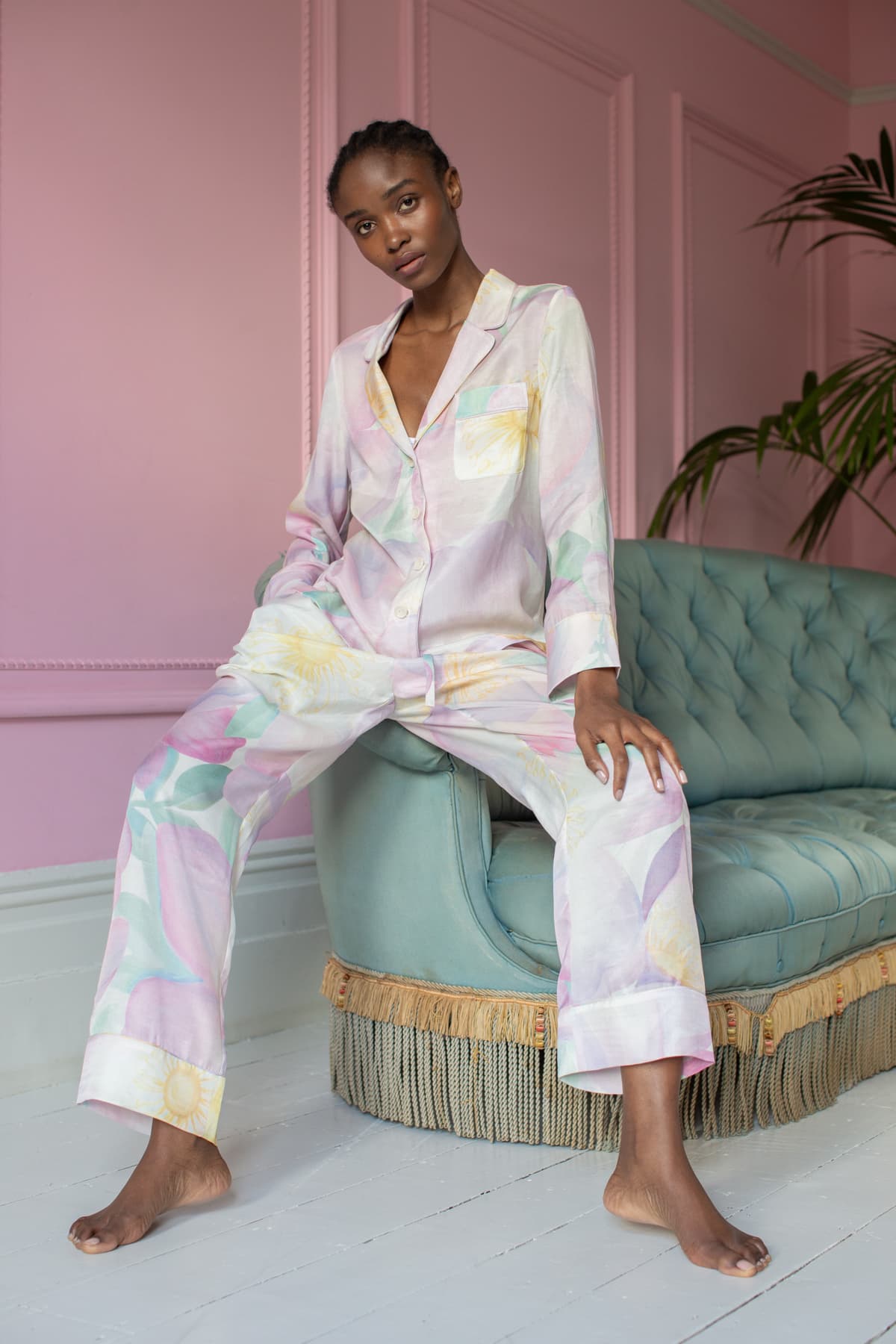 Wild Rose Luxury Pyjamas - Sitting on sofa - Orchard Moon - Sustainable Luxury Loungewear